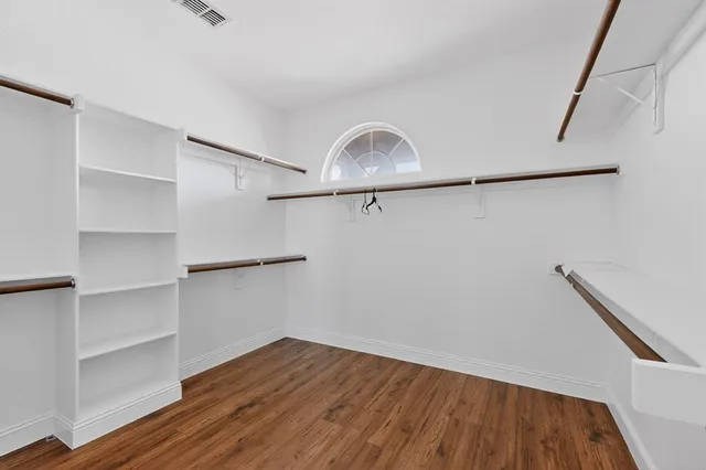a bathroom with a sink a vanity and a mirror
