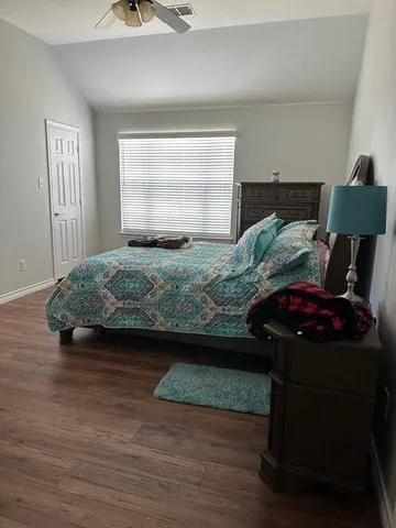 a bedroom with a bed and window