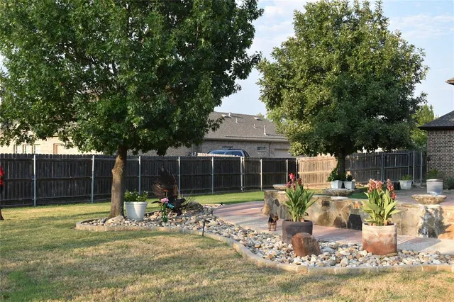 a view of a chair and tables in the patio