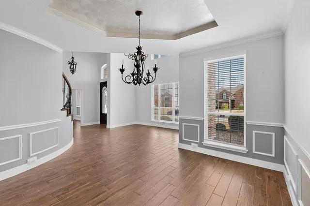 a kitchen with stainless steel appliances granite countertop a sink dishwasher and a stove with granite countertops