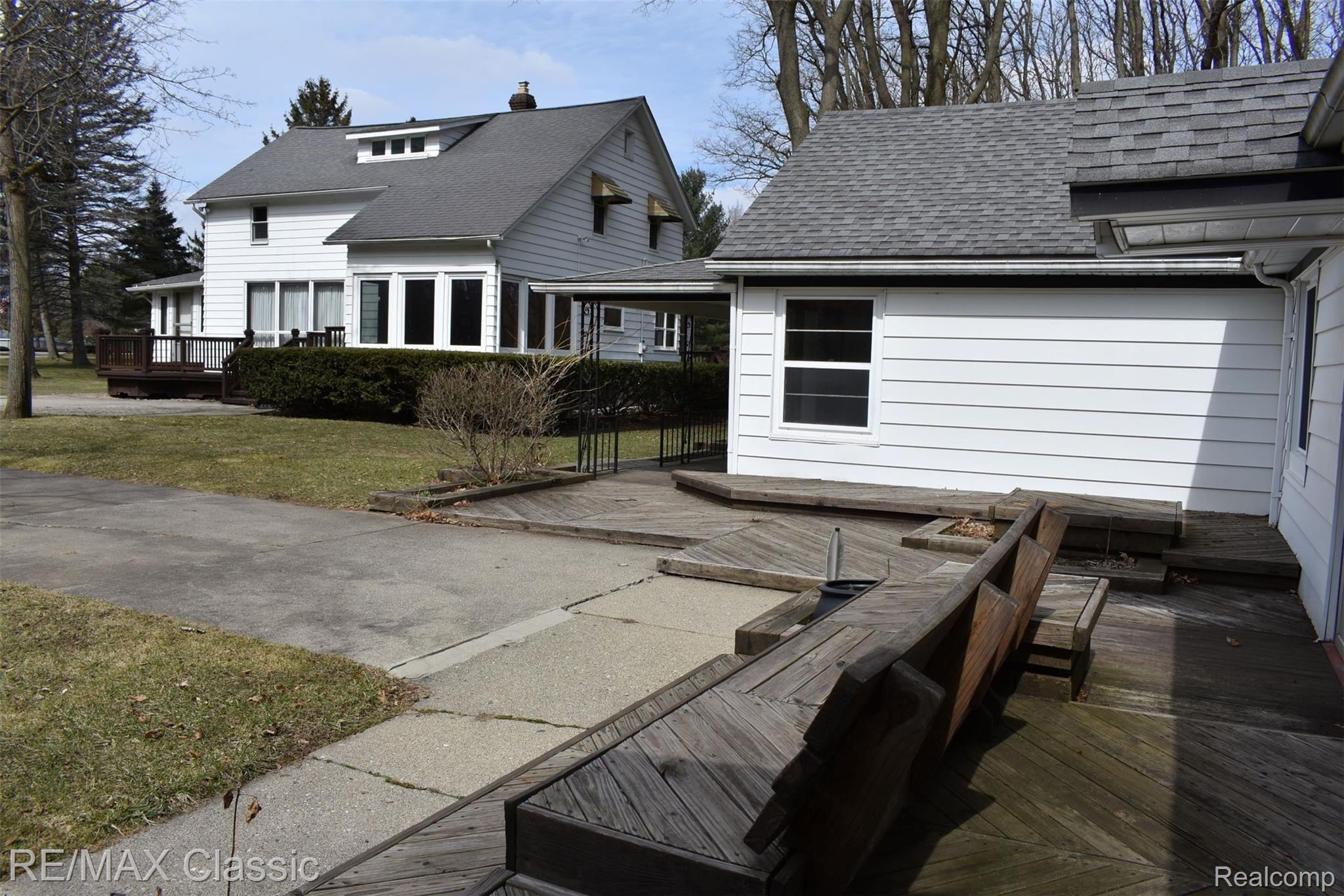 3980 Benstein Road Commerce Township, MI 48382 - Photo 67 of 68 Decking, patio, and benches in front of apartment 2