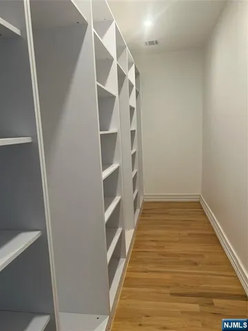 a view of a room with wooden floor and staircase