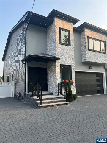 a view of living room kitchen with furniture and a fireplace