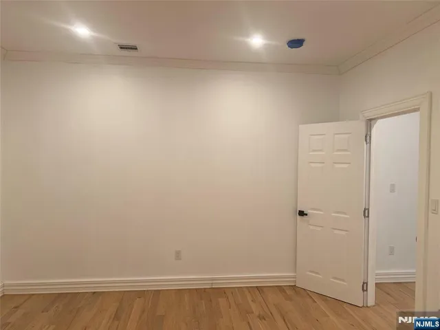 a white toilet sitting next to a shower