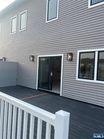 a view of a balcony with yard