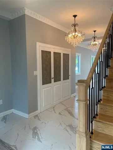 a view of a hallway with an entryway