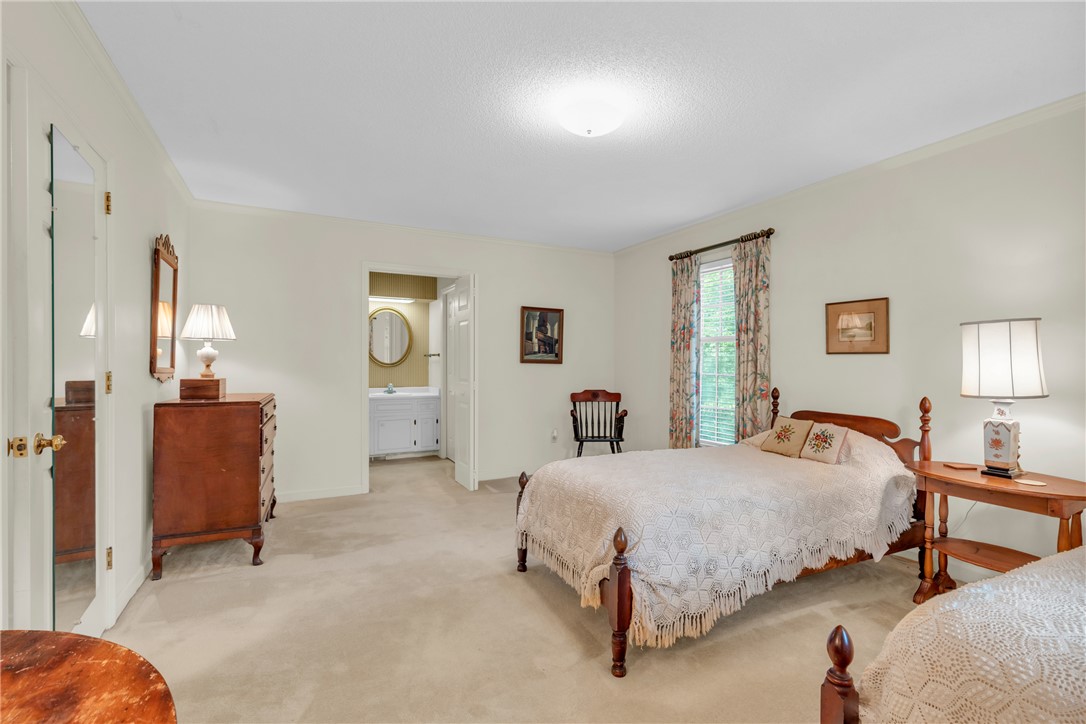 203 Fox Creek Road Anderson, SC 29621 - Photo 16 of 36 This spacious bedroom offers ample comfort and direct access to a private bathroom.