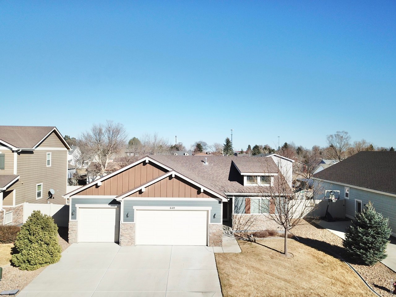 640 Cimarron Trail Ault, CO 80610 - Photo 1 of 15 a front view of a house with a yard