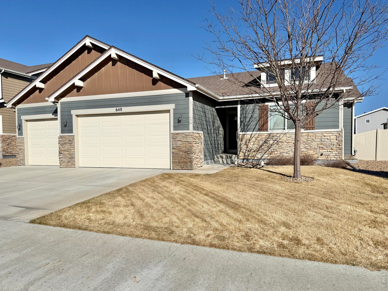 640 Cimarron Trail Ault, CO 80610 - Photo 2 of 15 a front view of a house with a yard