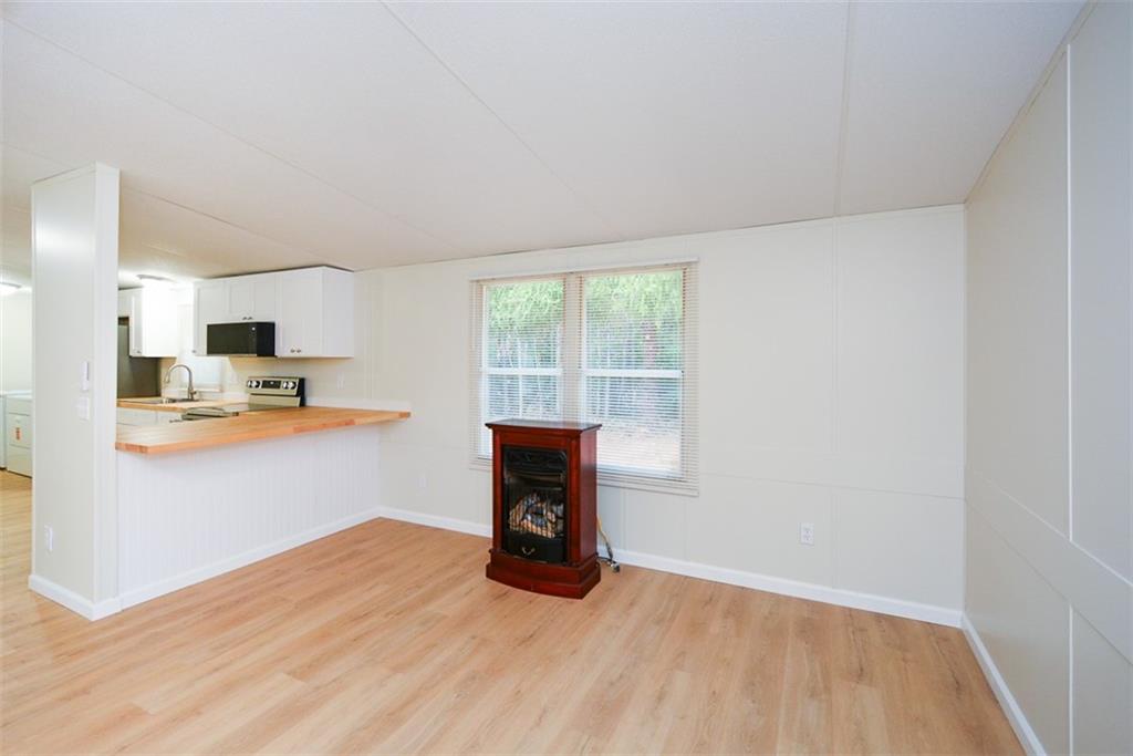 50 Damascus Road Talking Rock, GA 30175 - Photo 12 of 39 a kitchen with stainless steel appliances wooden floor and view living room