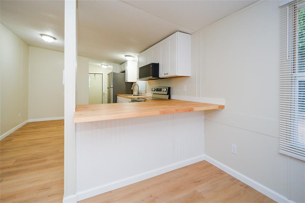 50 Damascus Road Talking Rock, GA 30175 - Photo 18 of 39 a view of a kitchen with microwave and cabinets