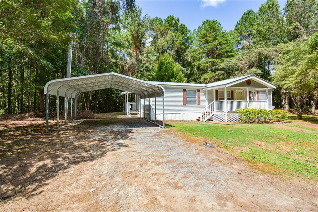 50 Damascus Road Talking Rock, GA 30175 - Photo 3 of 39 a front view of a house with garden