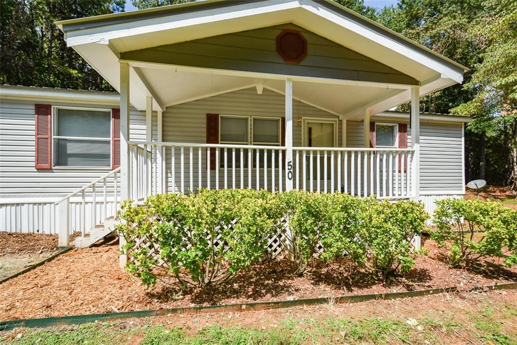 50 Damascus Road Talking Rock, GA 30175 - Photo 4 of 39 a front view of a house with garden
