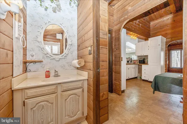 a bathroom with a sink a washer and dryer