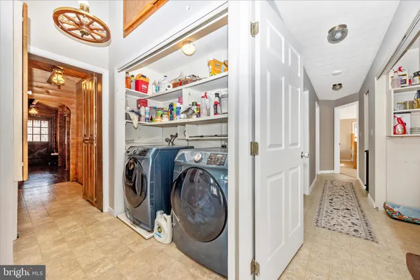a view of a hallway with washer and dryer