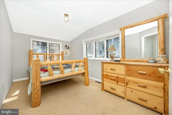 a bedroom with furniture and window