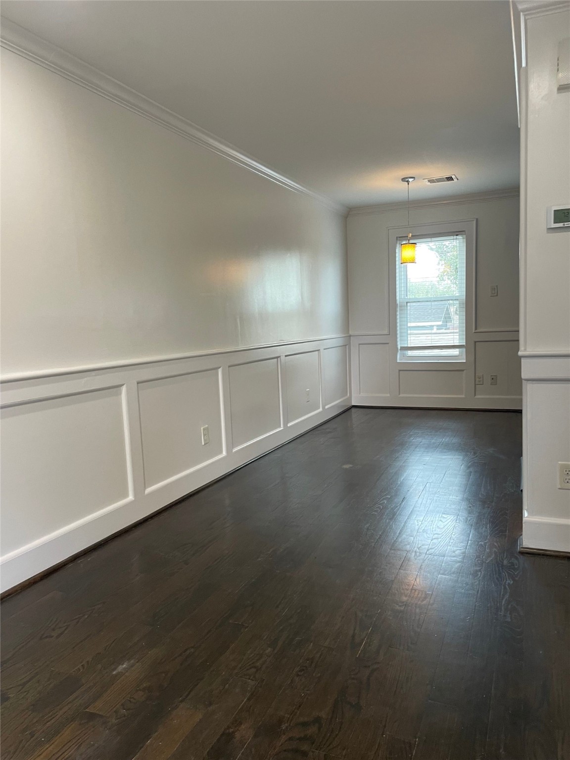 434 Lenard Street, Unit B Houston, TX 77009 - Photo 11 of 13 an empty room with wooden floor and windows