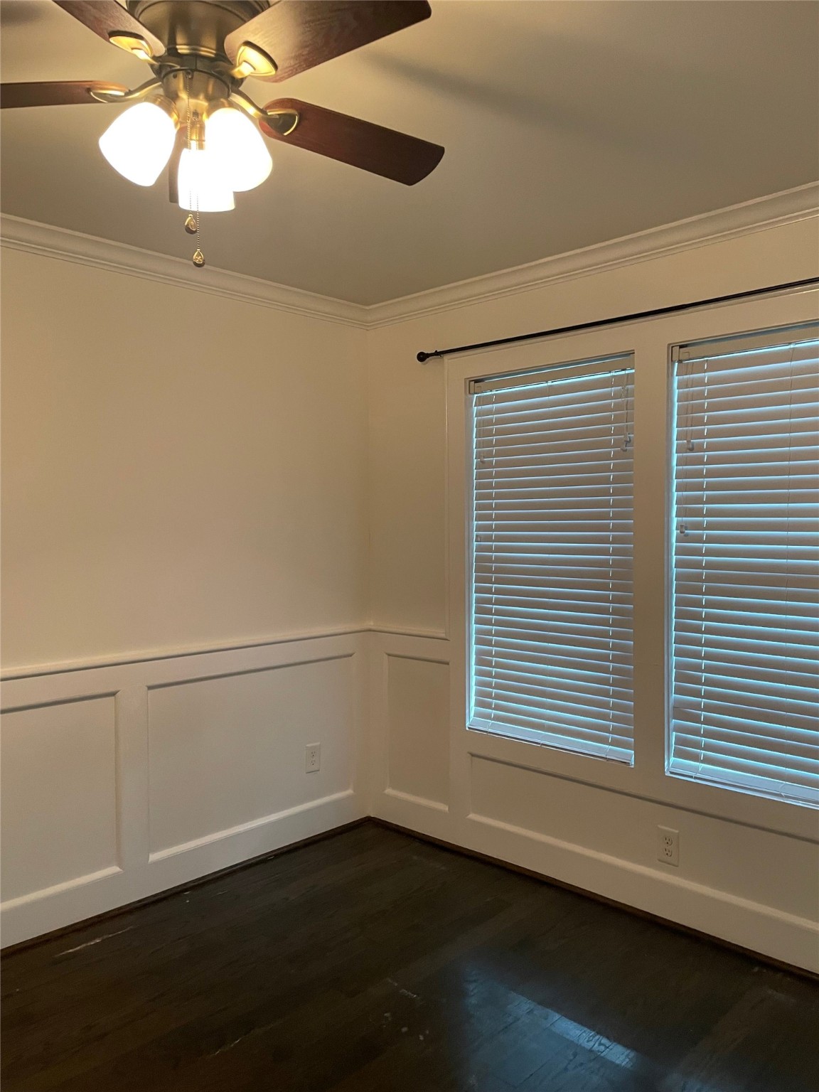 434 Lenard Street, Unit B Houston, TX 77009 - Photo 10 of 13 a view of an empty room with wooden floor and a window