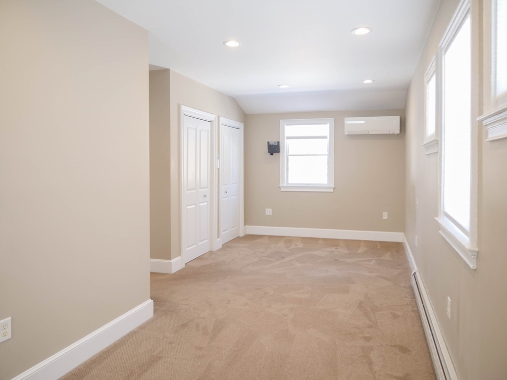 97 Hartwell Road Bedford, MA 01730 - Photo 24 of 42 an empty room with windows