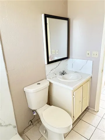 a utility room with cabinets washer and dryer
