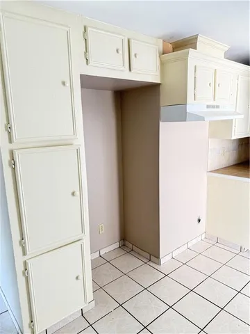 a kitchen with a stove a sink and a refrigerator