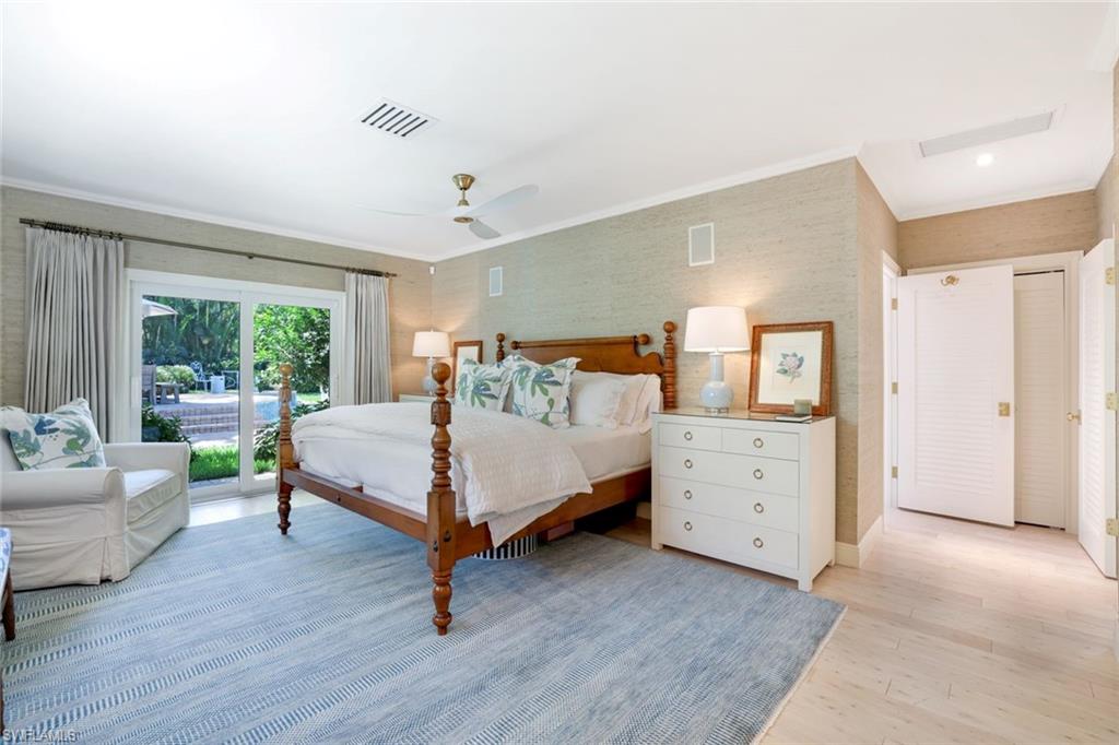 642 6th Avenue North Naples, FL 34102 - Photo 12 of 25 Bedroom with access to outside, light wood-type flooring, crown molding, a ceiling fan, and wallpapered walls