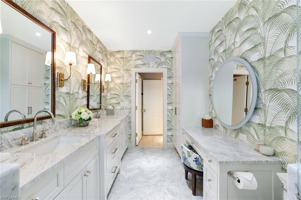642 6th Avenue North Naples, FL 34102 - Photo 15 of 25 Full bath featuring wallpapered walls, double vanity, recessed lighting, and light marble finish flooring