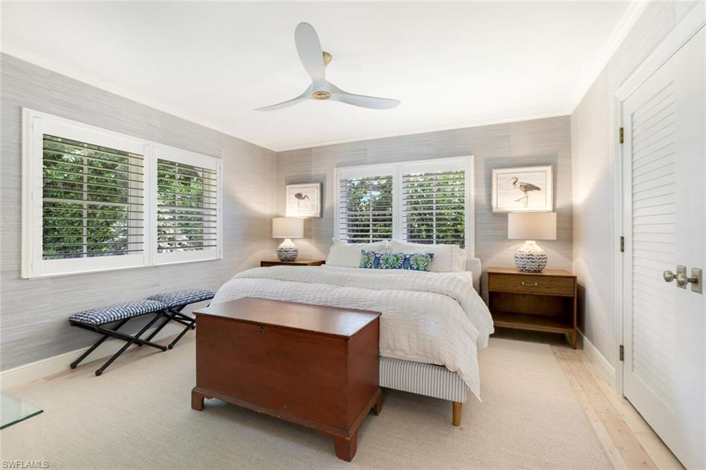 642 6th Avenue North Naples, FL 34102 - Photo 16 of 25 Bedroom featuring ceiling fan and ornamental molding