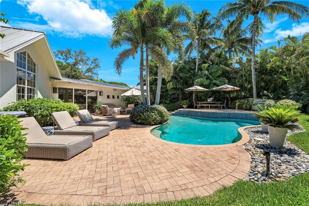 642 6th Avenue North Naples, FL 34102 - Photo 25 of 25 Outdoor pool with a patio area