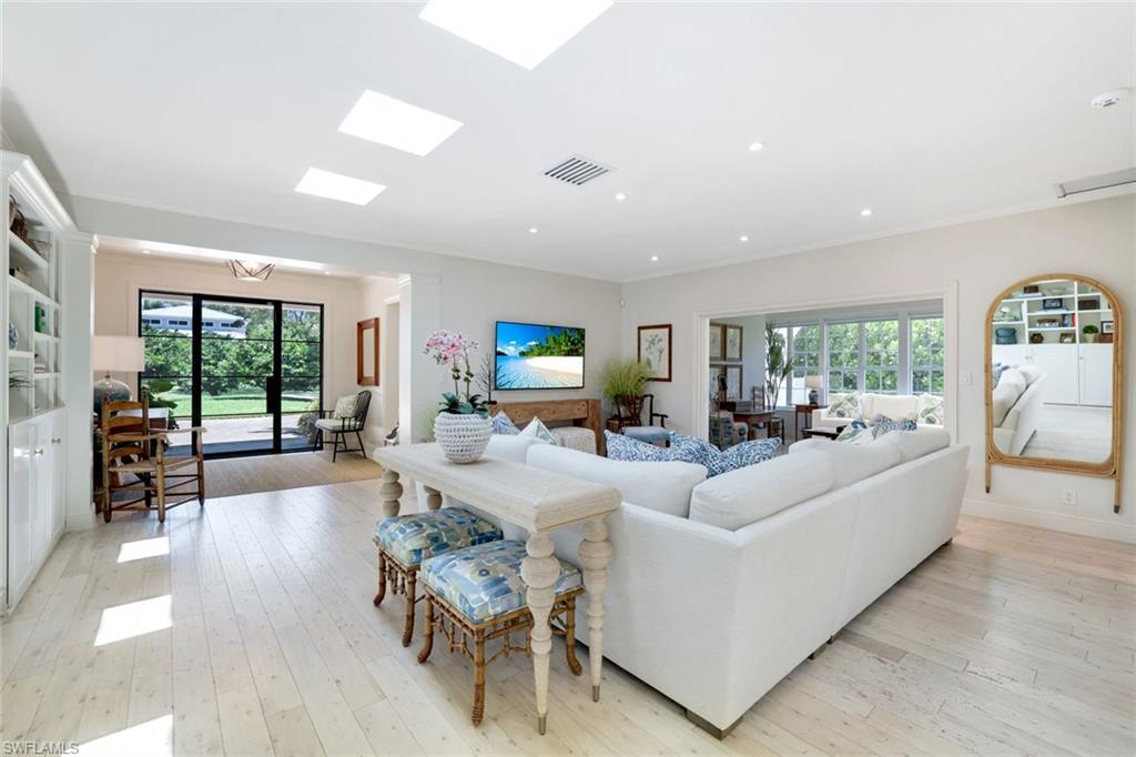 642 6th Avenue North Naples, FL 34102 - Photo 6 of 25 Living area with light wood-style floors, ornamental molding, and recessed lighting