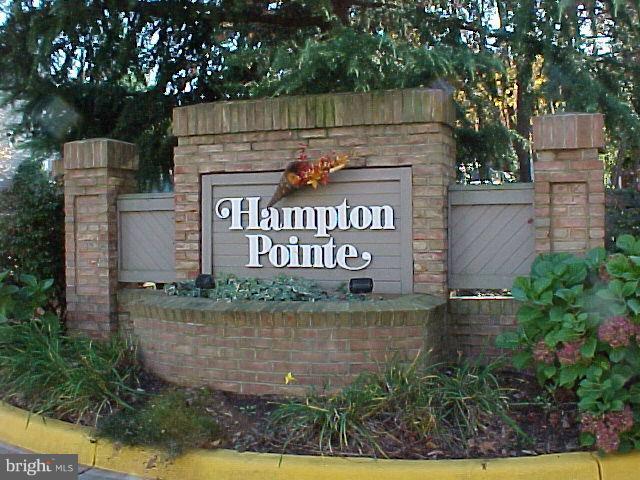 1521 Church Hill Place, Unit 1521 Reston, VA 20194 - Photo 1 of 20 a view of a street sign under a tree