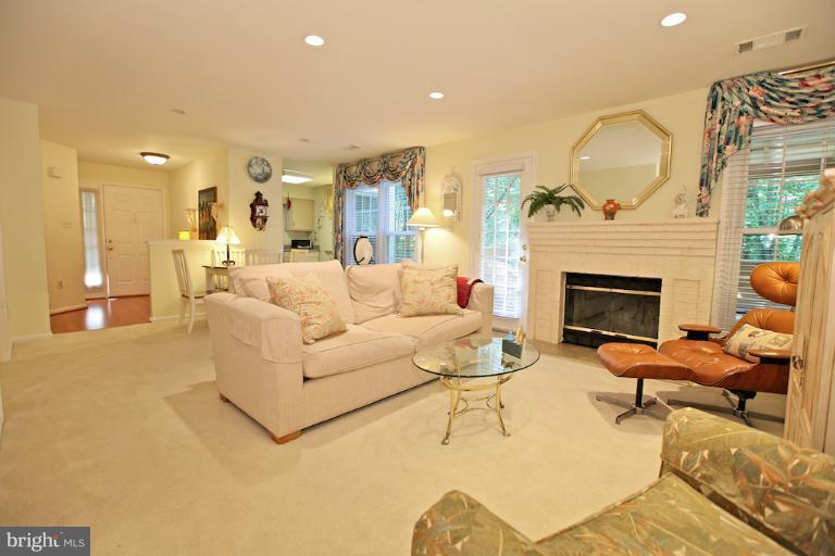 1521 Church Hill Place, Unit 1521 Reston, VA 20194 - Photo 15 of 20 a living room with furniture and a fireplace