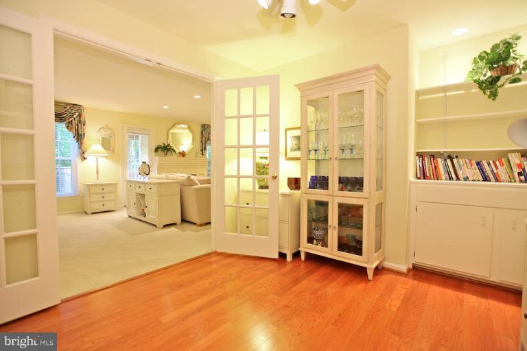 1521 Church Hill Place, Unit 1521 Reston, VA 20194 - Photo 17 of 20 a view of a livingroom with wooden floor and windows