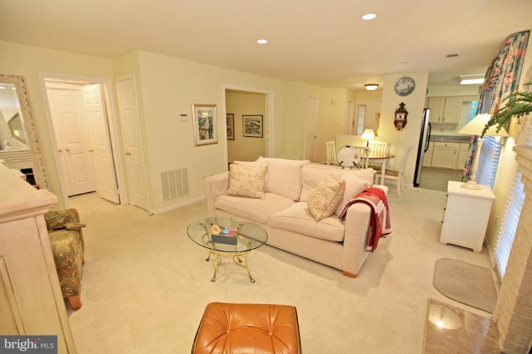 1521 Church Hill Place, Unit 1521 Reston, VA 20194 - Photo 7 of 20 a living room with furniture and a table