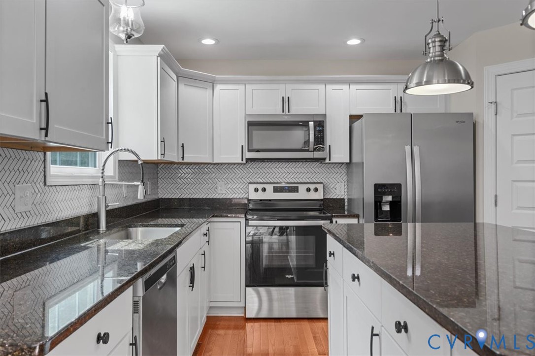 1290 Scotts Court Carson, VA 23830 - Photo 14 of 46 a kitchen with a sink stove and refrigerator