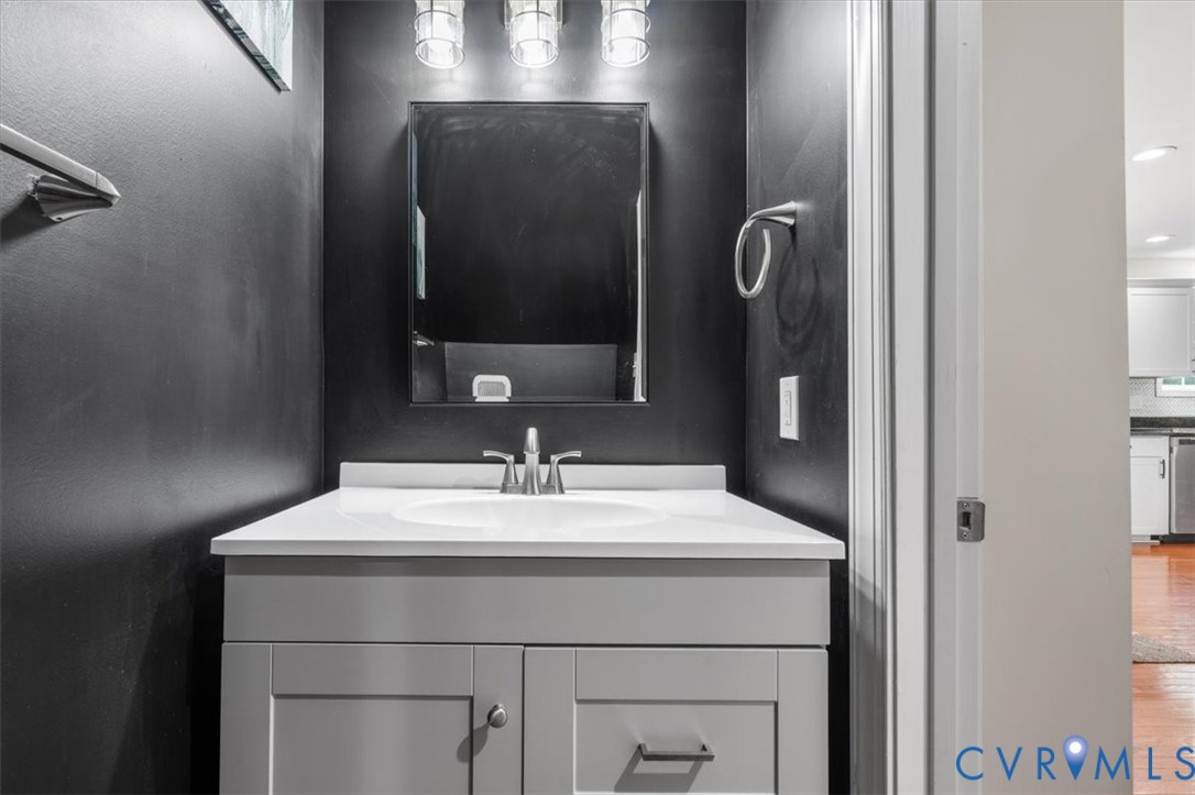 1290 Scotts Court Carson, VA 23830 - Photo 17 of 46 a bathroom with a sink vanity and a mirror