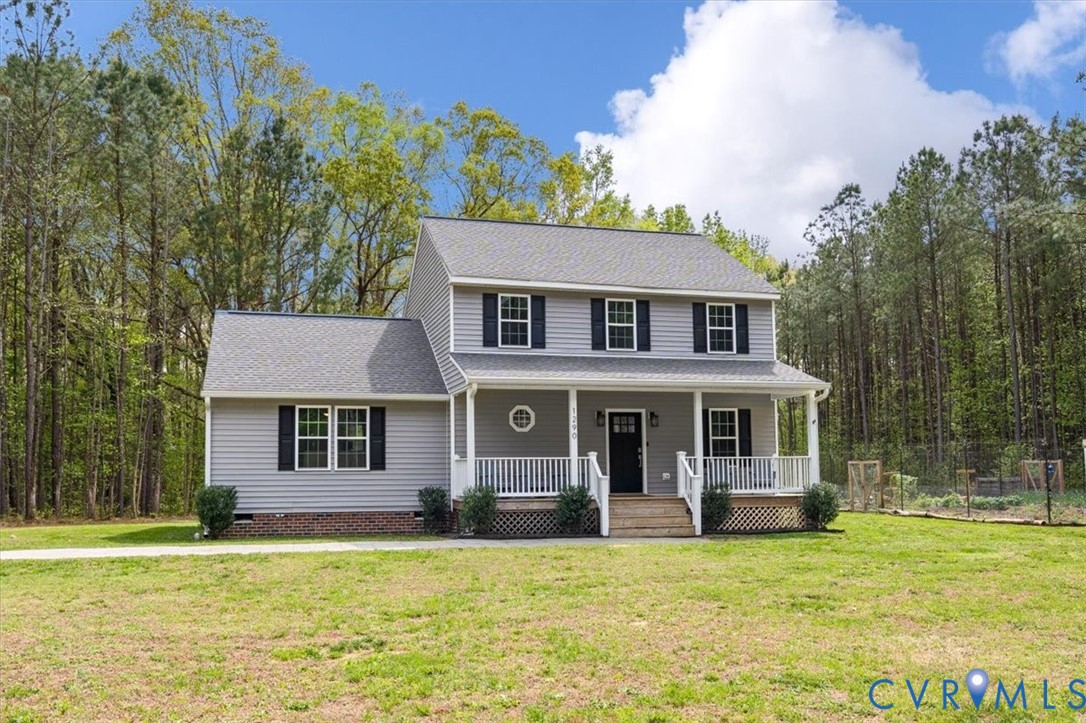 1290 Scotts Court Carson, VA 23830 - Photo 2 of 46 a front view of a house with a garden