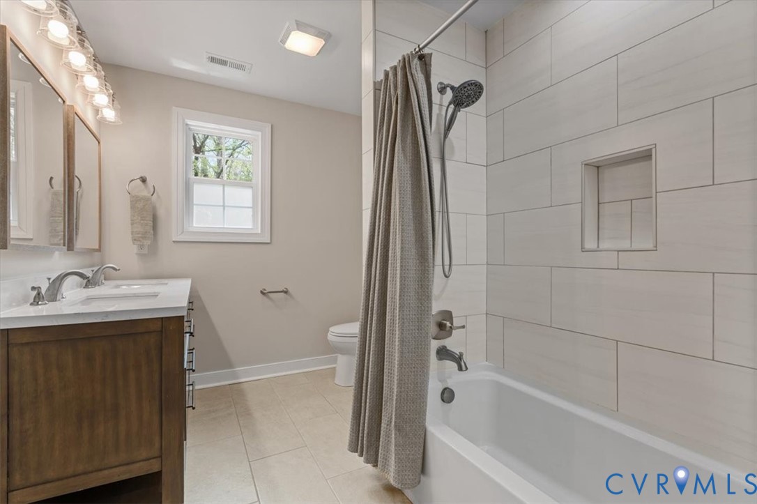 1290 Scotts Court Carson, VA 23830 - Photo 28 of 46 a bathroom with a tub sink vanity and a mirror