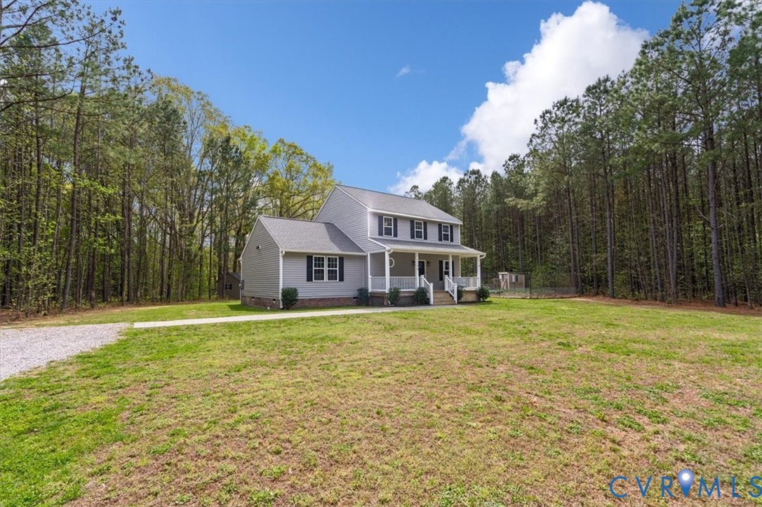 1290 Scotts Court Carson, VA 23830 - Photo 3 of 46 a front view of a house with a yard