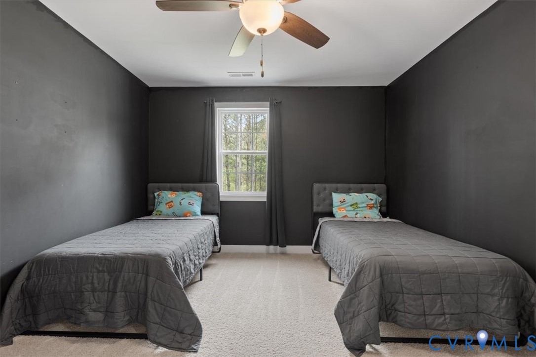 1290 Scotts Court Carson, VA 23830 - Photo 36 of 46 a bedroom with a bed and a window