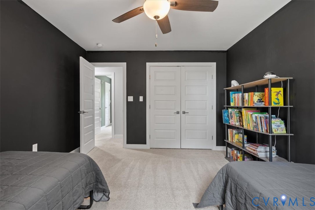 1290 Scotts Court Carson, VA 23830 - Photo 37 of 46 a bedroom with furniture and a book shelf