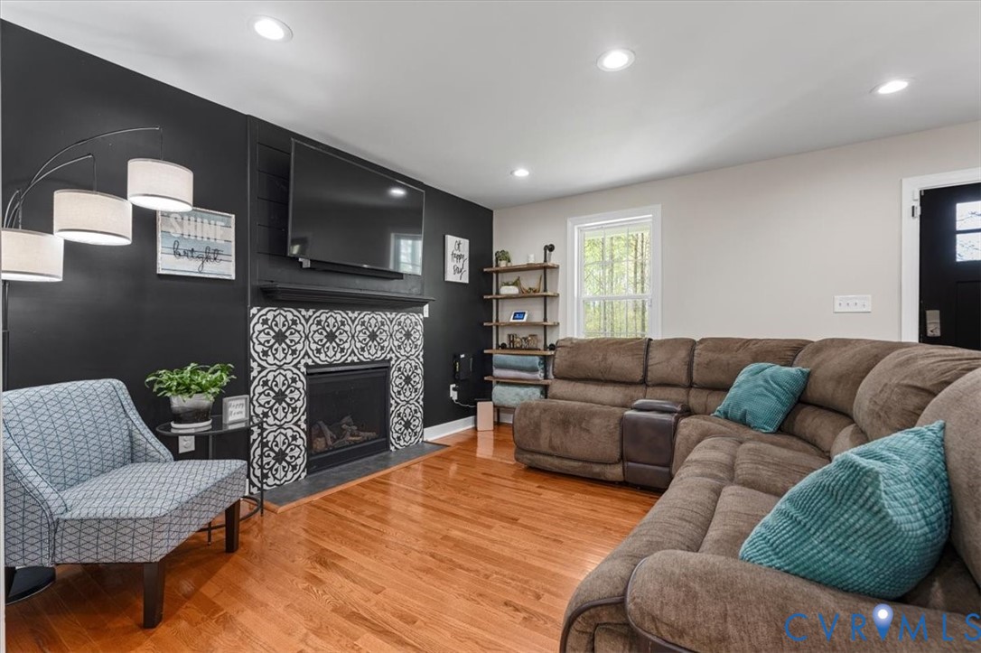 1290 Scotts Court Carson, VA 23830 - Photo 6 of 46 a living room with furniture and a fireplace
