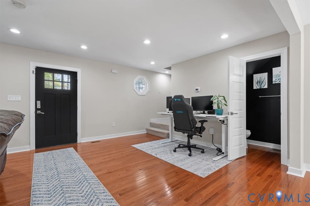 1290 Scotts Court Carson, VA 23830 - Photo 8 of 46 a view of a workspace with furniture and wooden floor