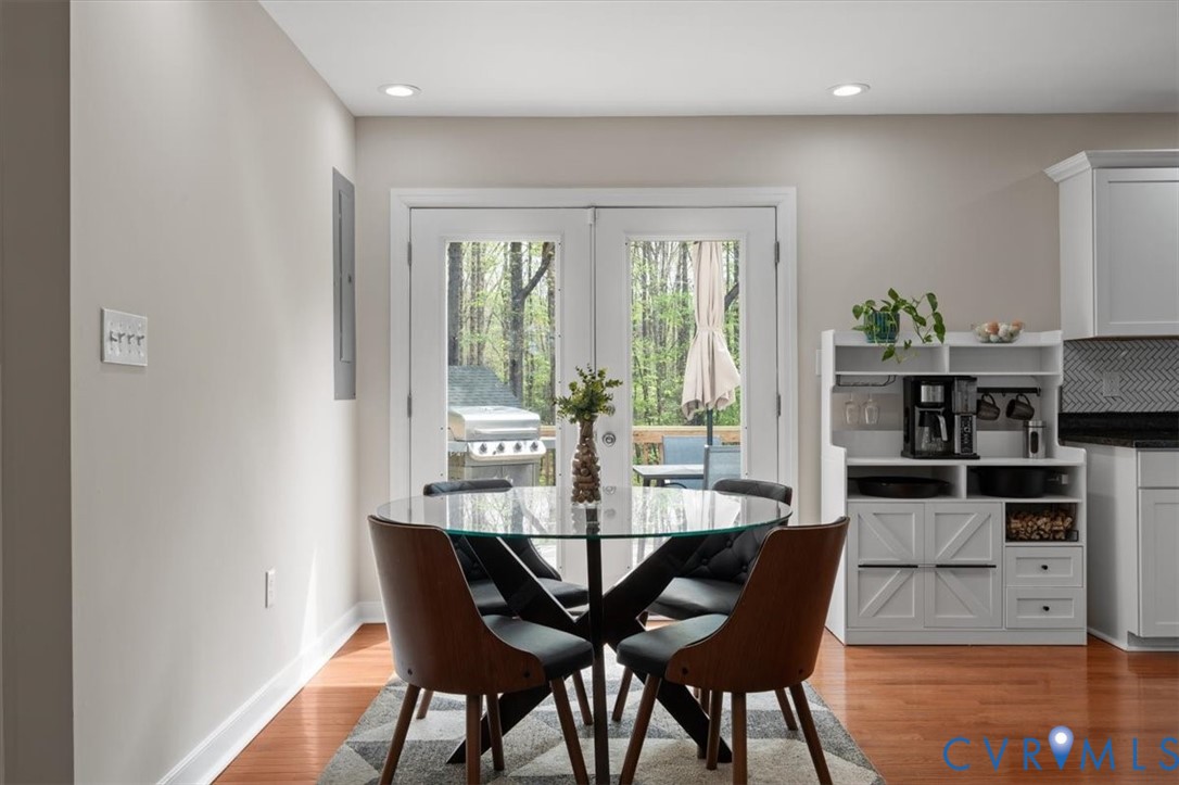 1290 Scotts Court Carson, VA 23830 - Photo 9 of 46 a view of a dining room with furniture window and wooden floor