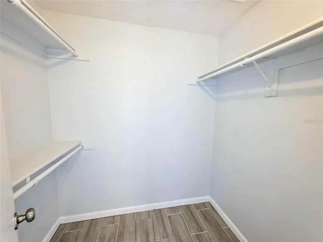 a bathroom with a bathtub shower sink vanity and toilet
