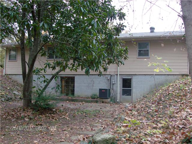 705 Baker Road Smyrna, TN 37167 - Photo 4 of 20 Back of home, walk-out basement door (new) and a large picture window lets lots of light into basement.