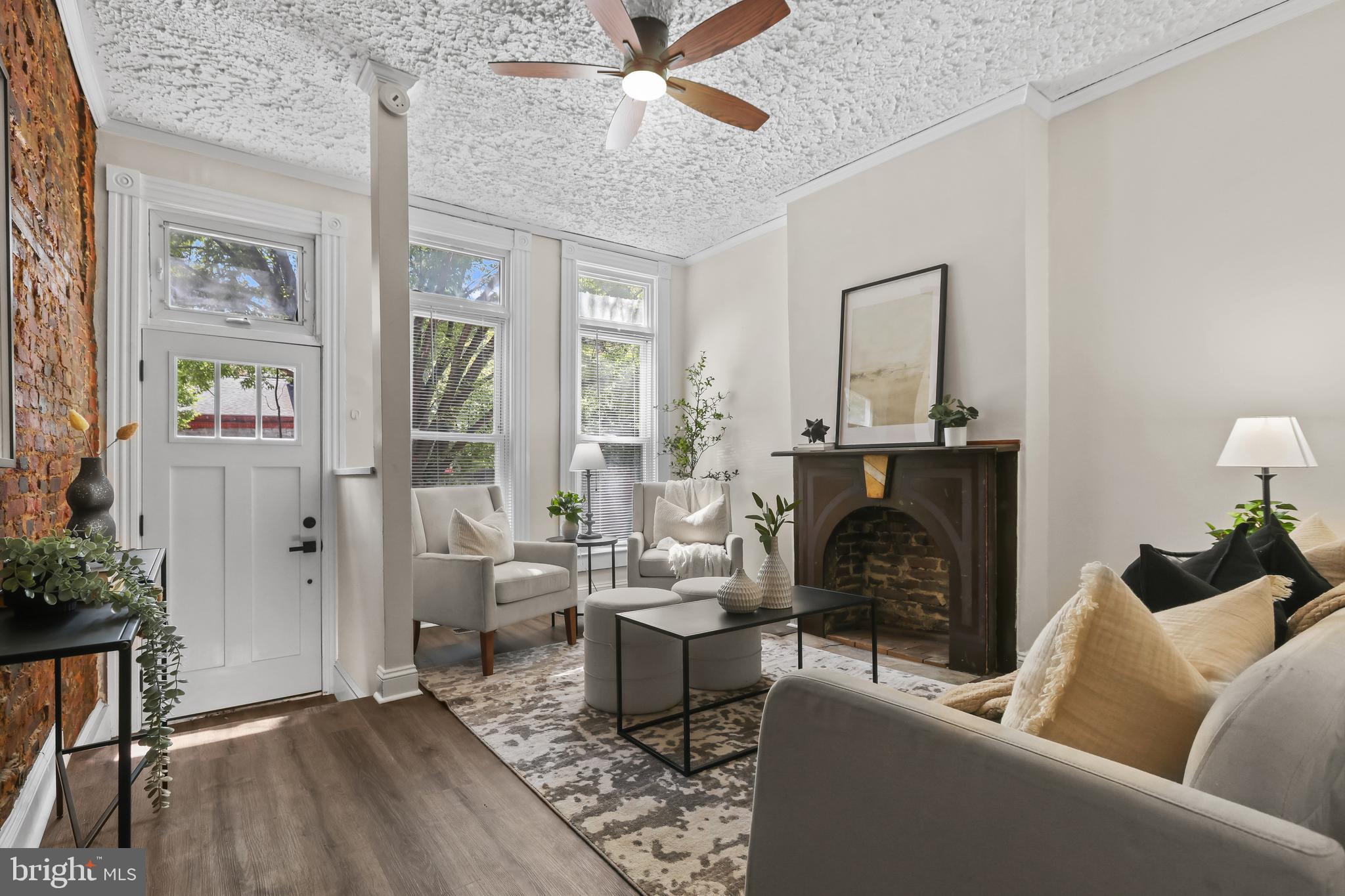 884 Washington Boulevard Baltimore, MD 21230 - Photo 11 of 35 a living room with furniture and a fireplace