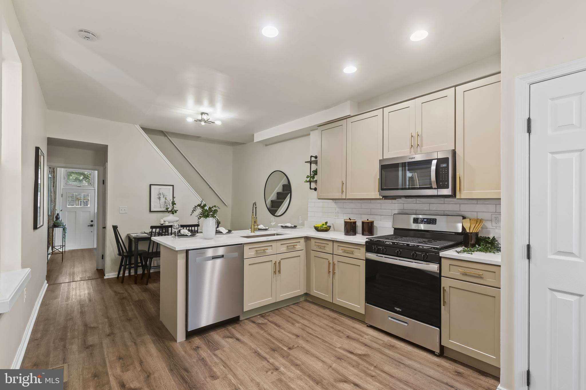 884 Washington Boulevard Baltimore, MD 21230 - Photo 15 of 35 a kitchen with stainless steel appliances a sink stove and cabinets
