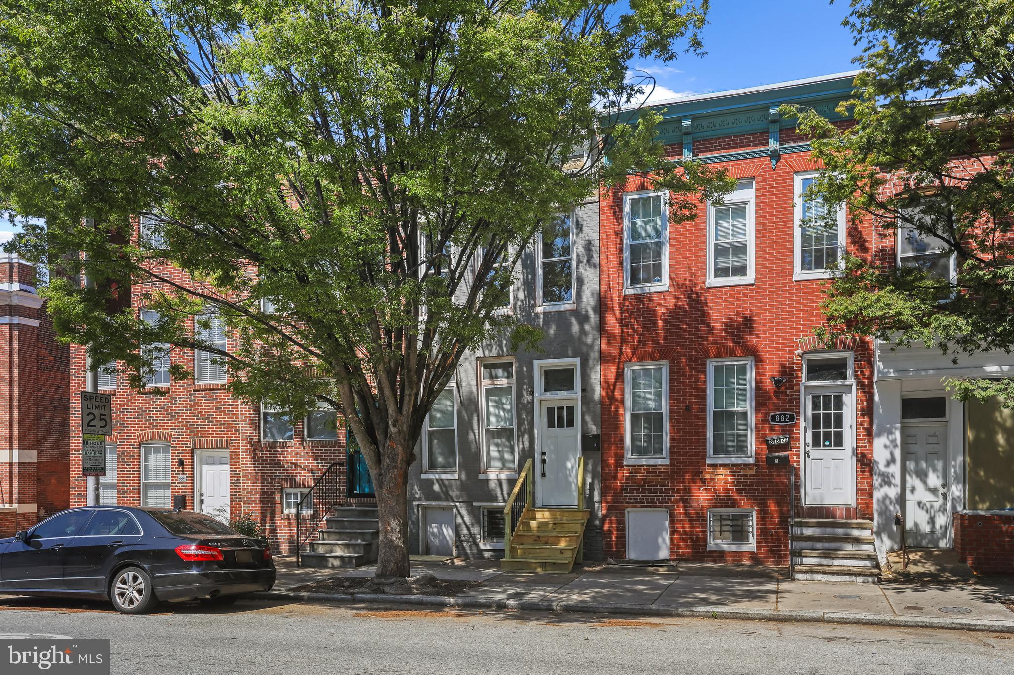 884 Washington Boulevard Baltimore, MD 21230 - Photo 2 of 35 a city street lined with buildings and trees