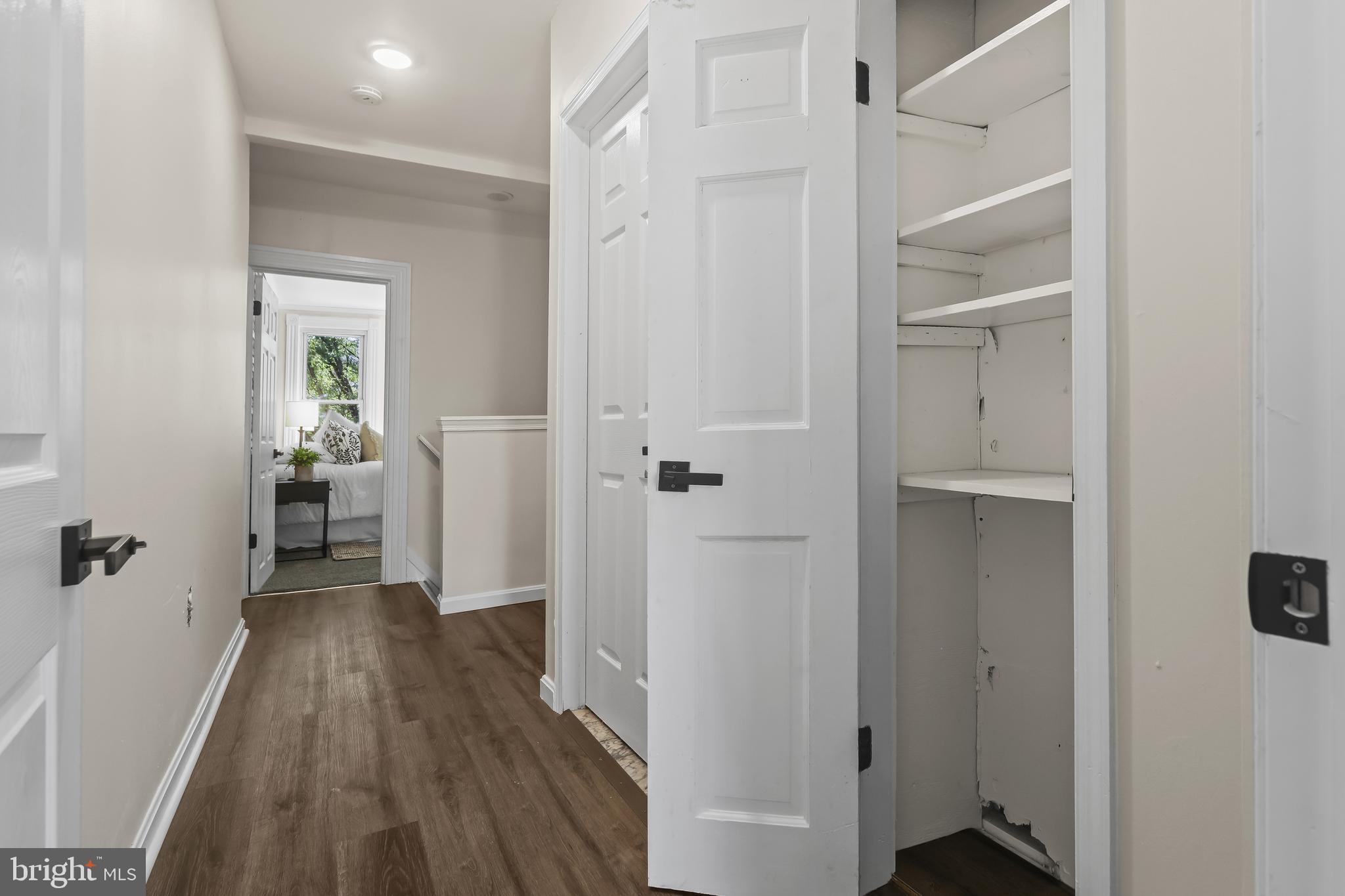 884 Washington Boulevard Baltimore, MD 21230 - Photo 26 of 35 a view of a hallway view with wooden floor and closet